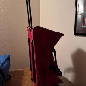 TAG red duffel bag/roller   excellent condition.